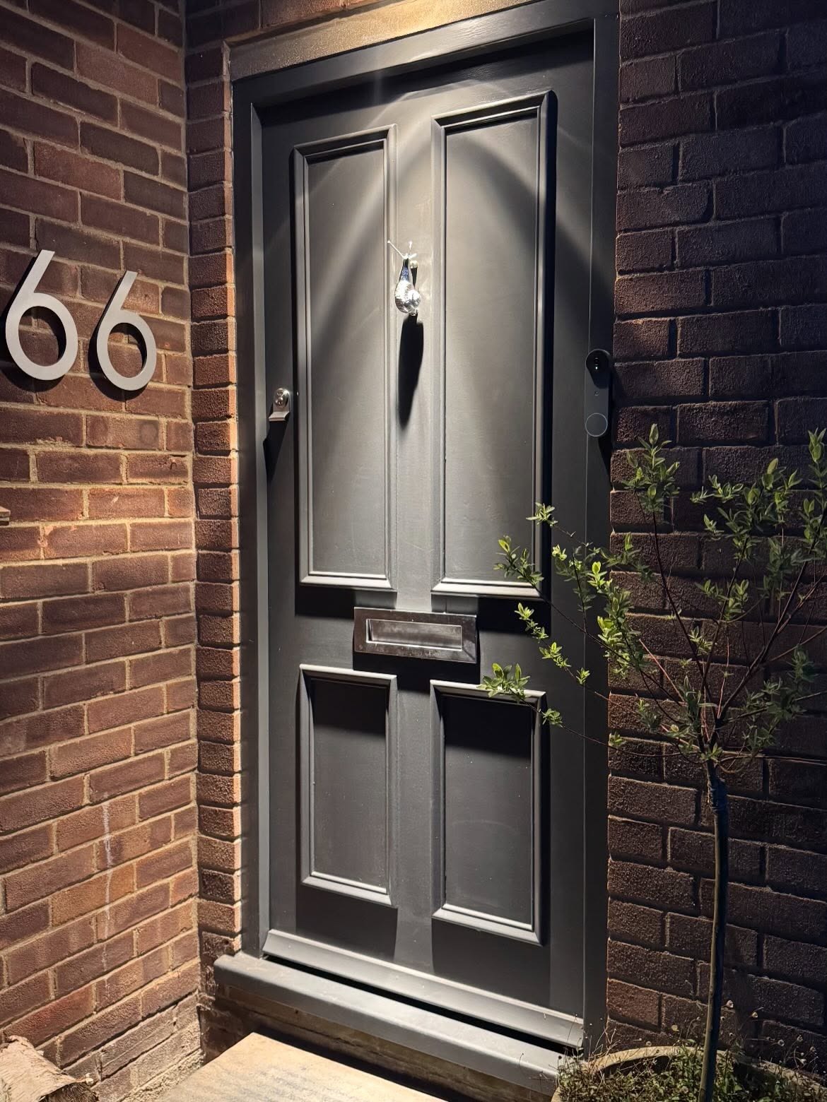New grey front door with chrome hardware fitted by CV Carpentry & Construction