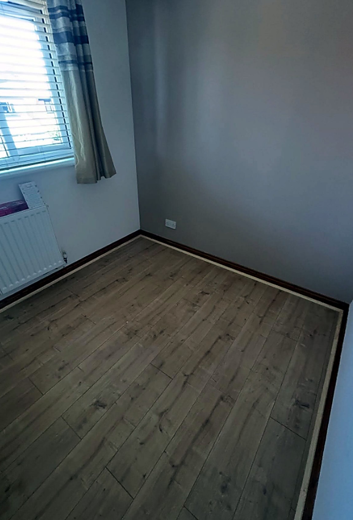 Freshly fitted skirting board with a clean mitred joint, Cambridge second fix carpentry