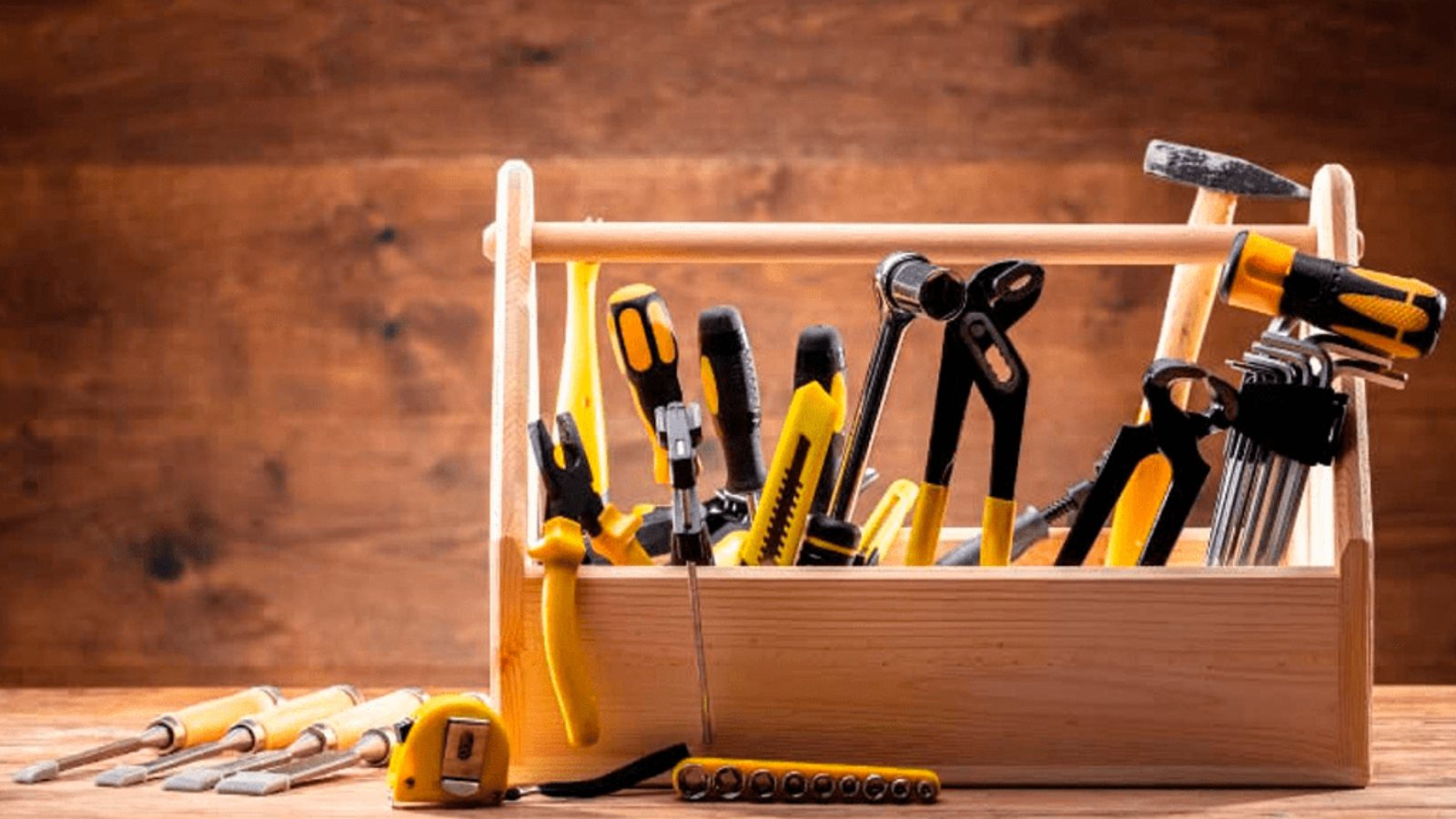 Professional handyman toolbox with screwdrivers, pliers, hammer and tape measure, handyman services in Cambridge
